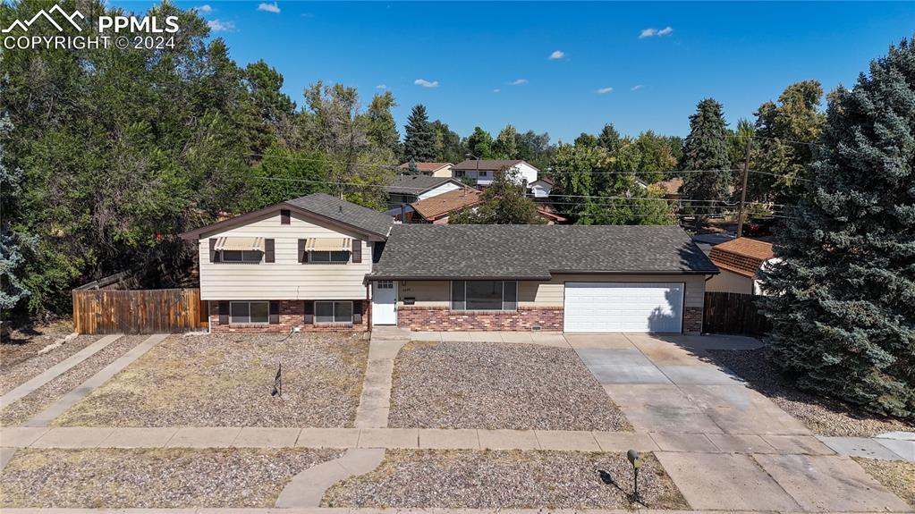 Updated tri-level home with front yard xeroscaping and dual driveways