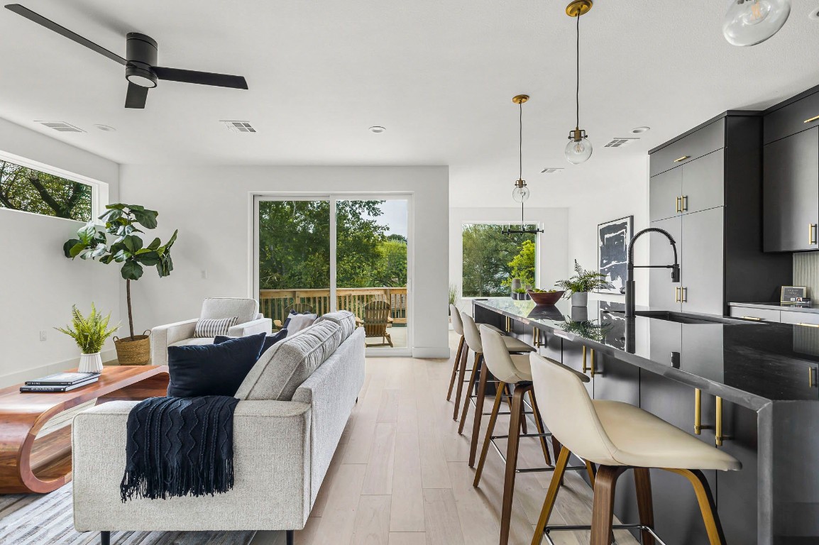 a living room with furniture a window and appliances