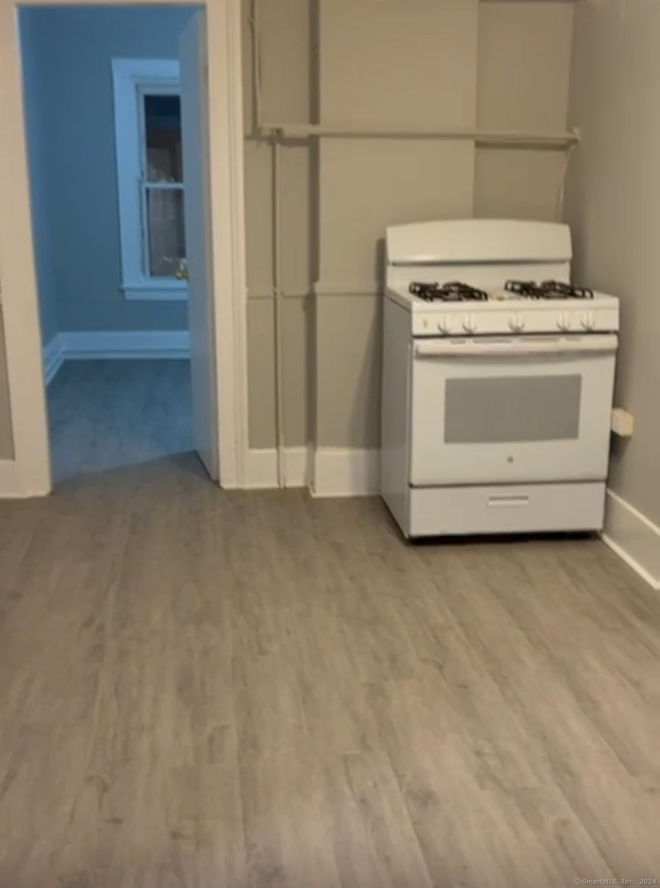 a view of stove top oven and cabinets