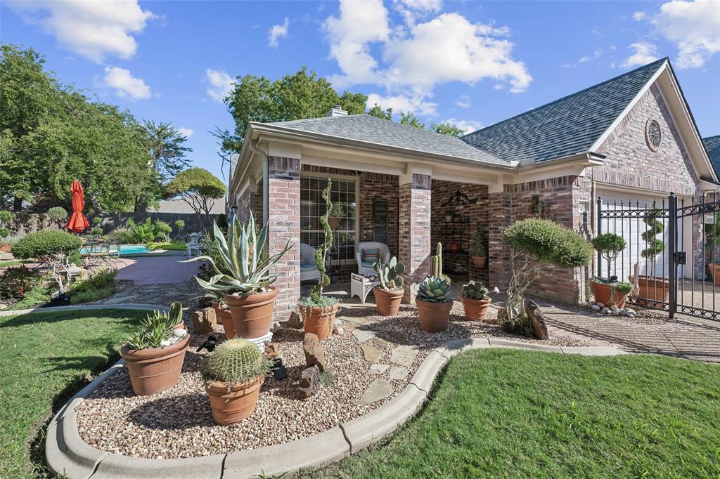 a view of a house with backyard sitting area and garden