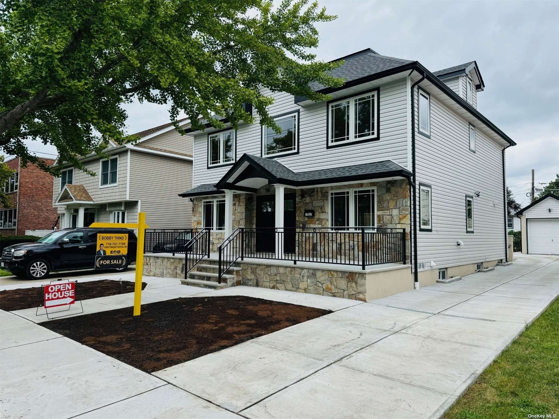 a front view of a house with sitting area