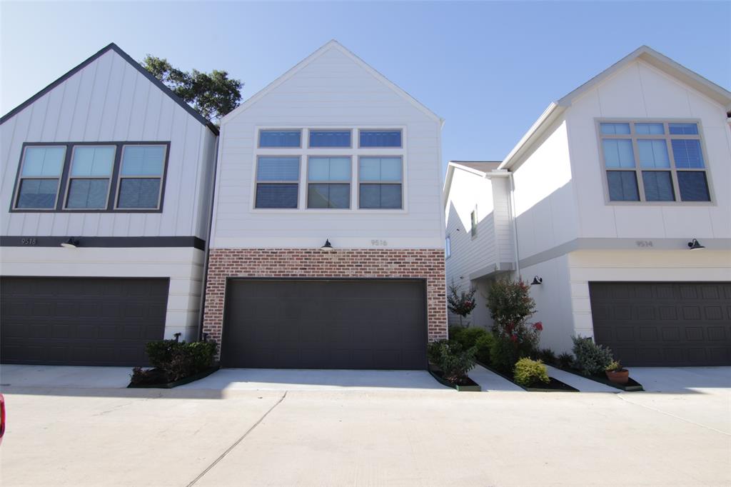 a front view of a house with yard