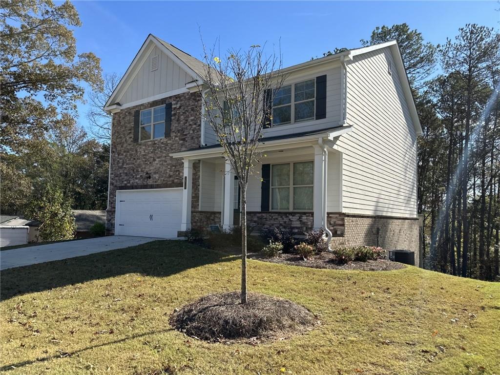 a front view of a house with a yard