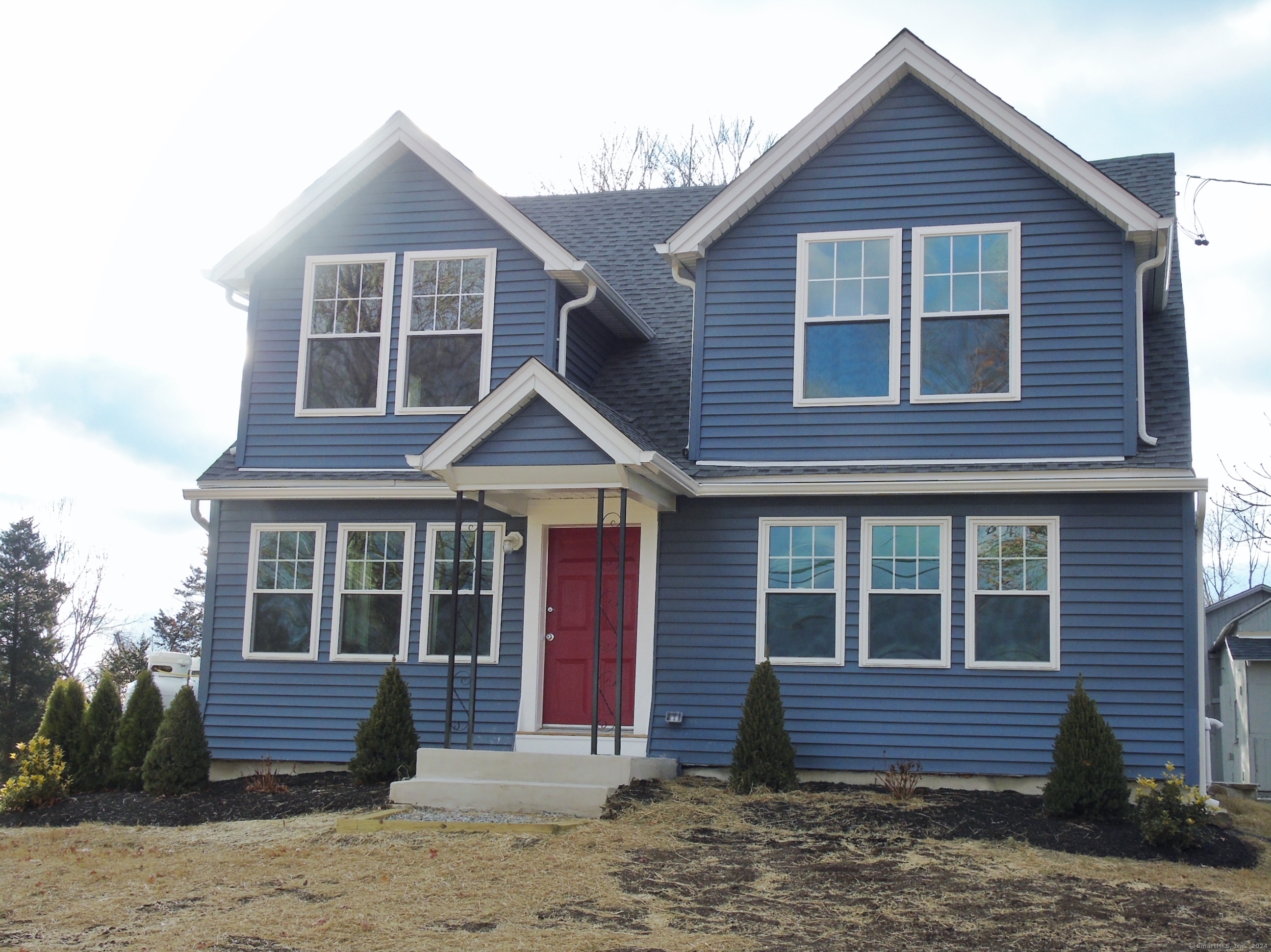 a front view of a house with a yard