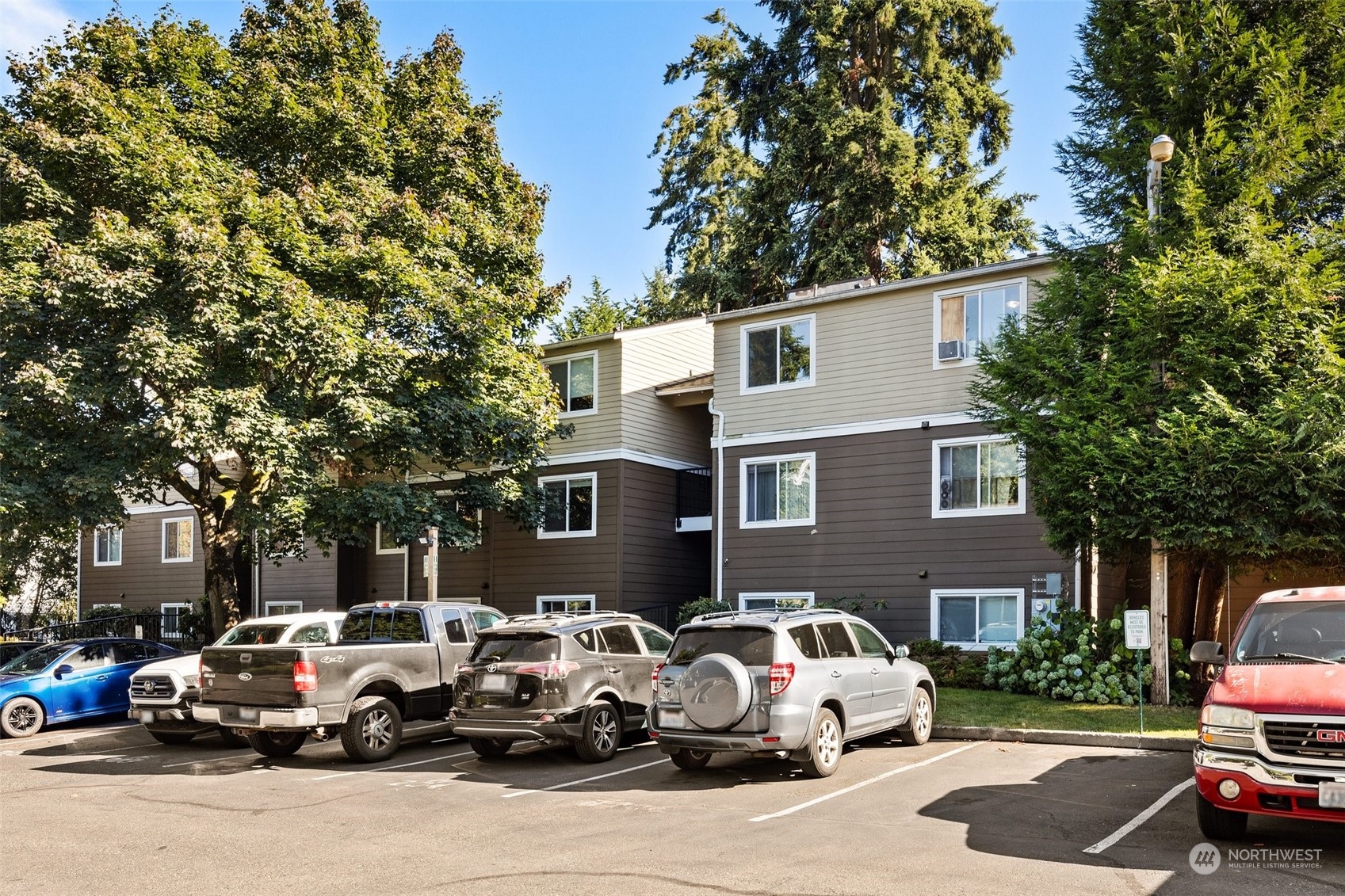 a group of cars parked in front of a house