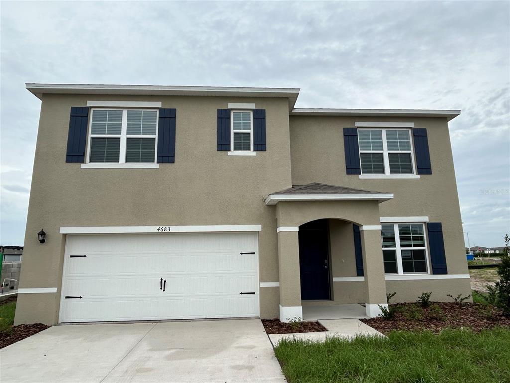 a front view of a house with yard