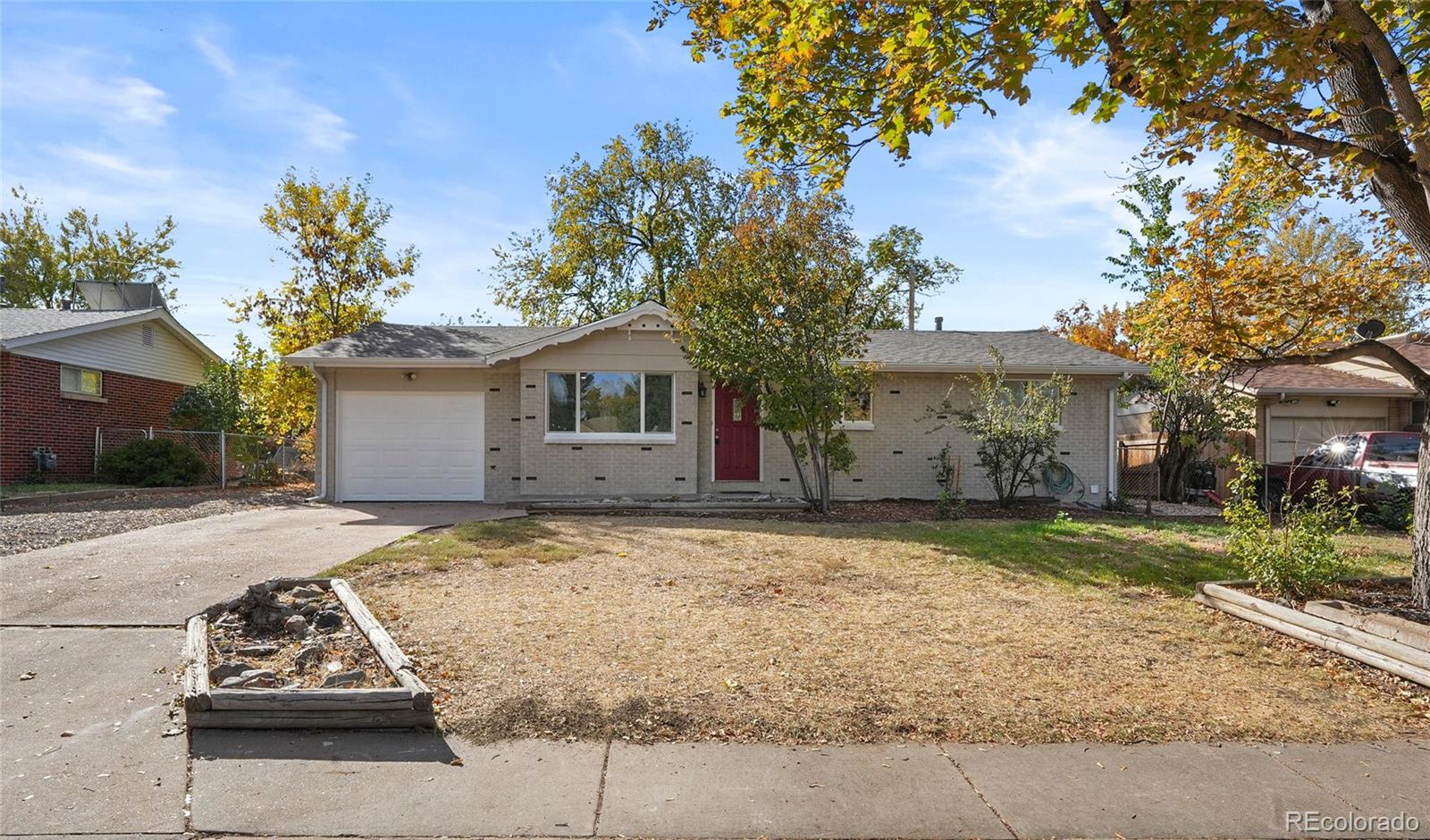 front view of a house with a yard