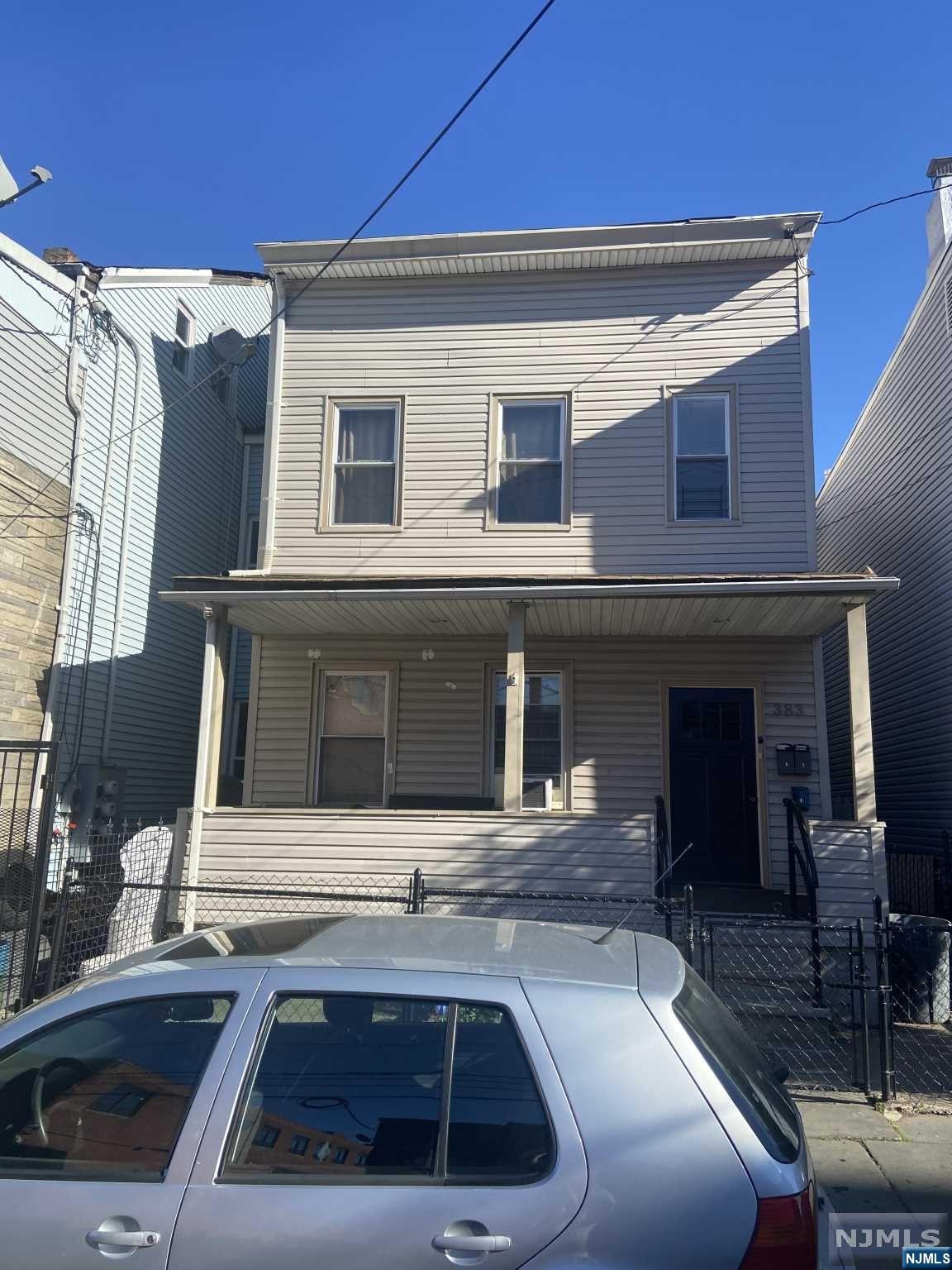 a front view of a house with parking