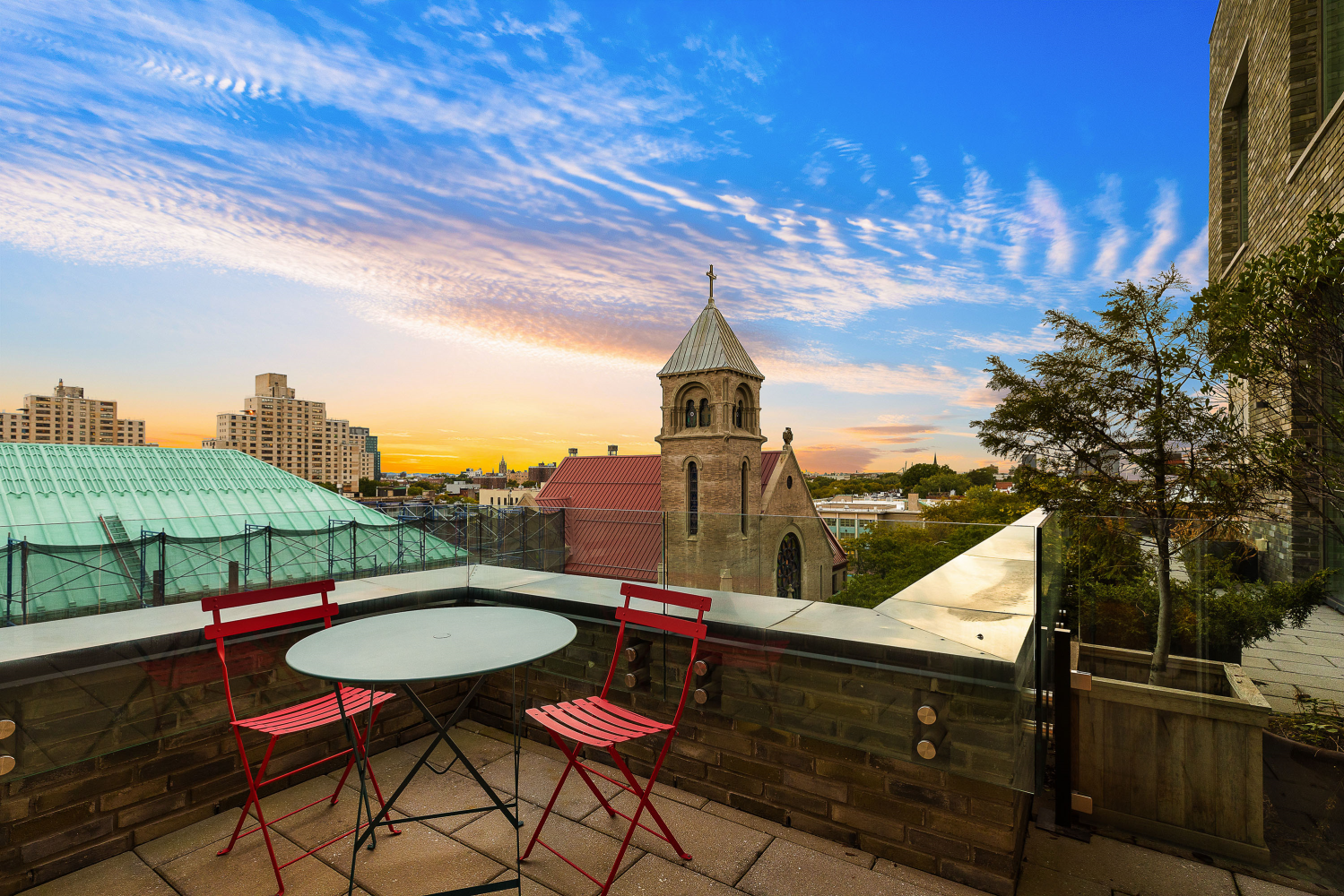 a view of swimming pool with outdoor seating and city view