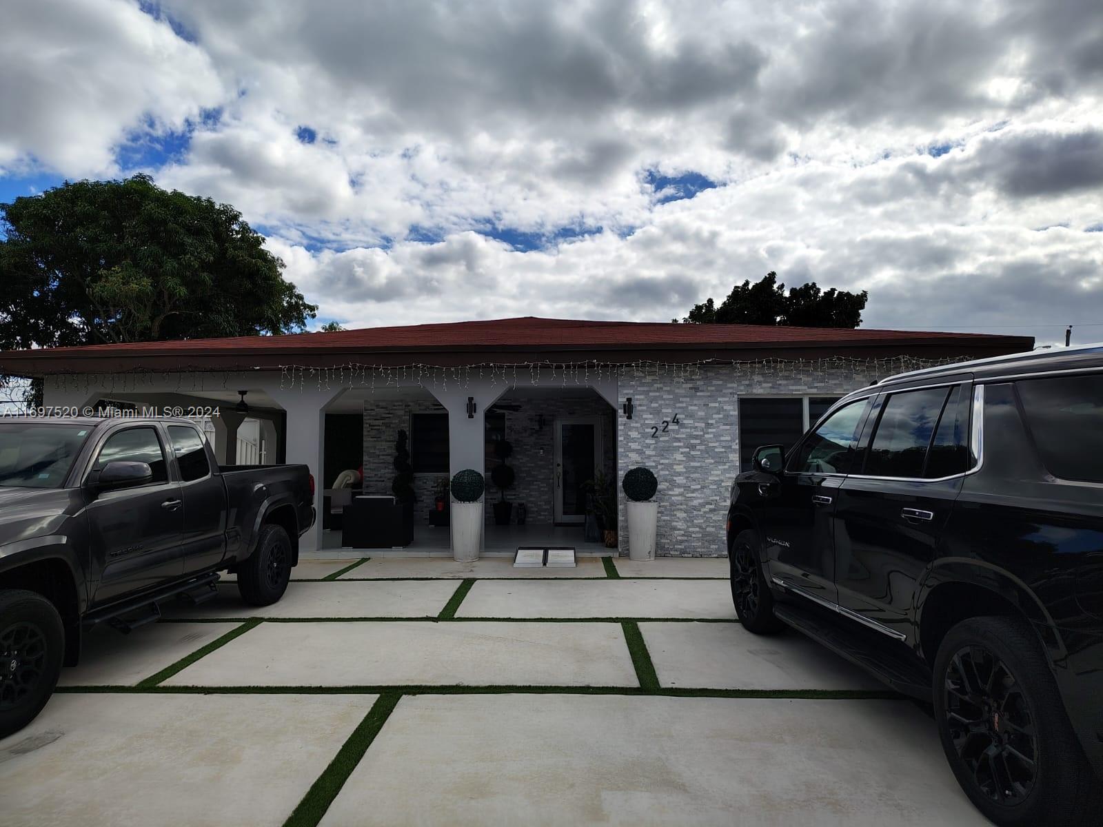 a view of a car parked in front of a house