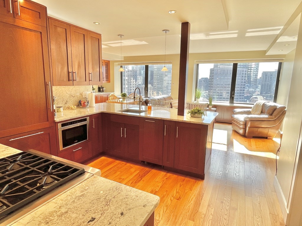 a kitchen with a large window and a sink