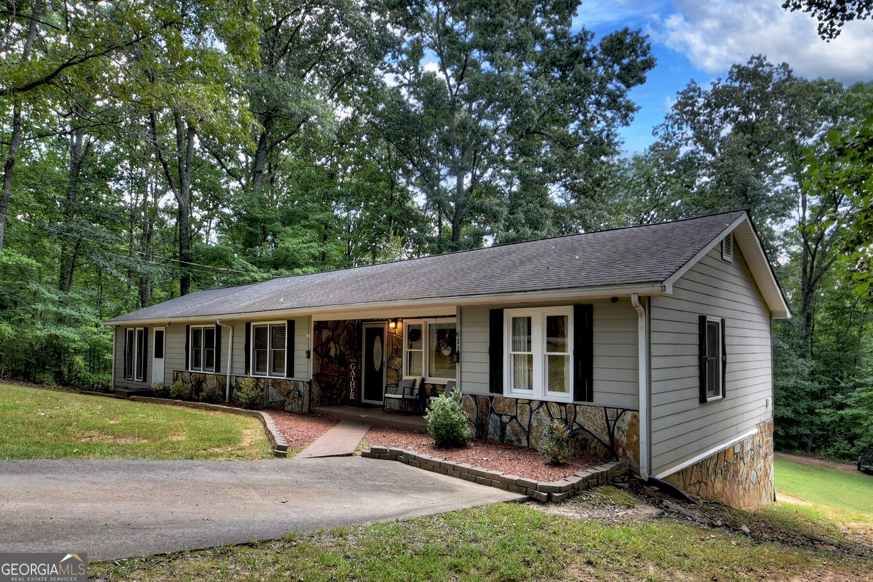 a view of house with a yard