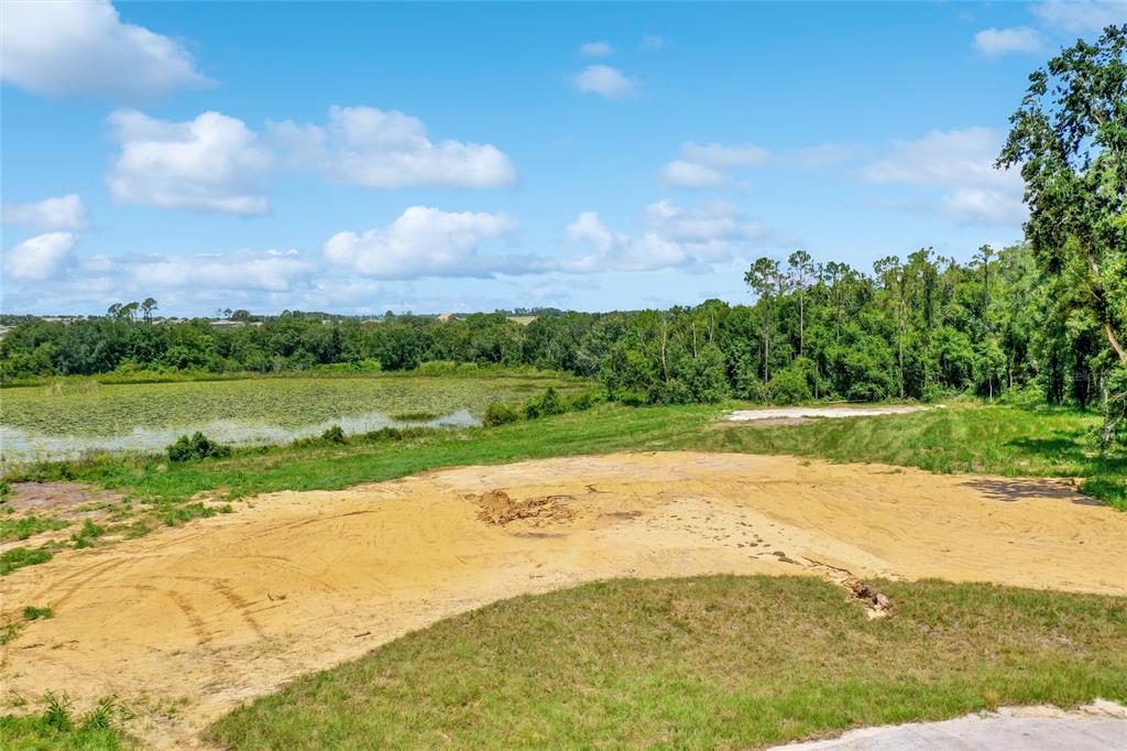 a view of a lake with a big yard