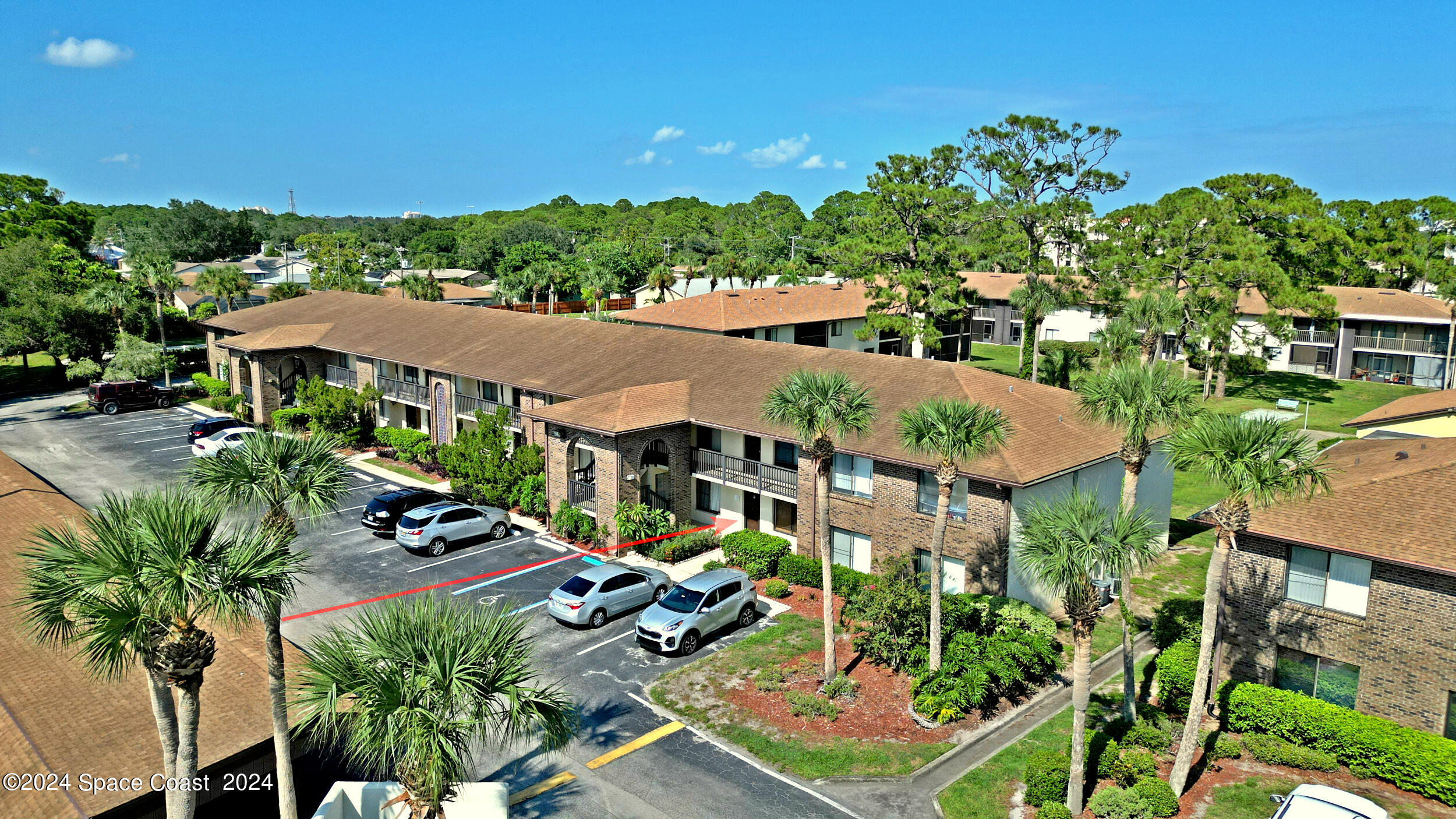 an aerial view of multiple houses with yard