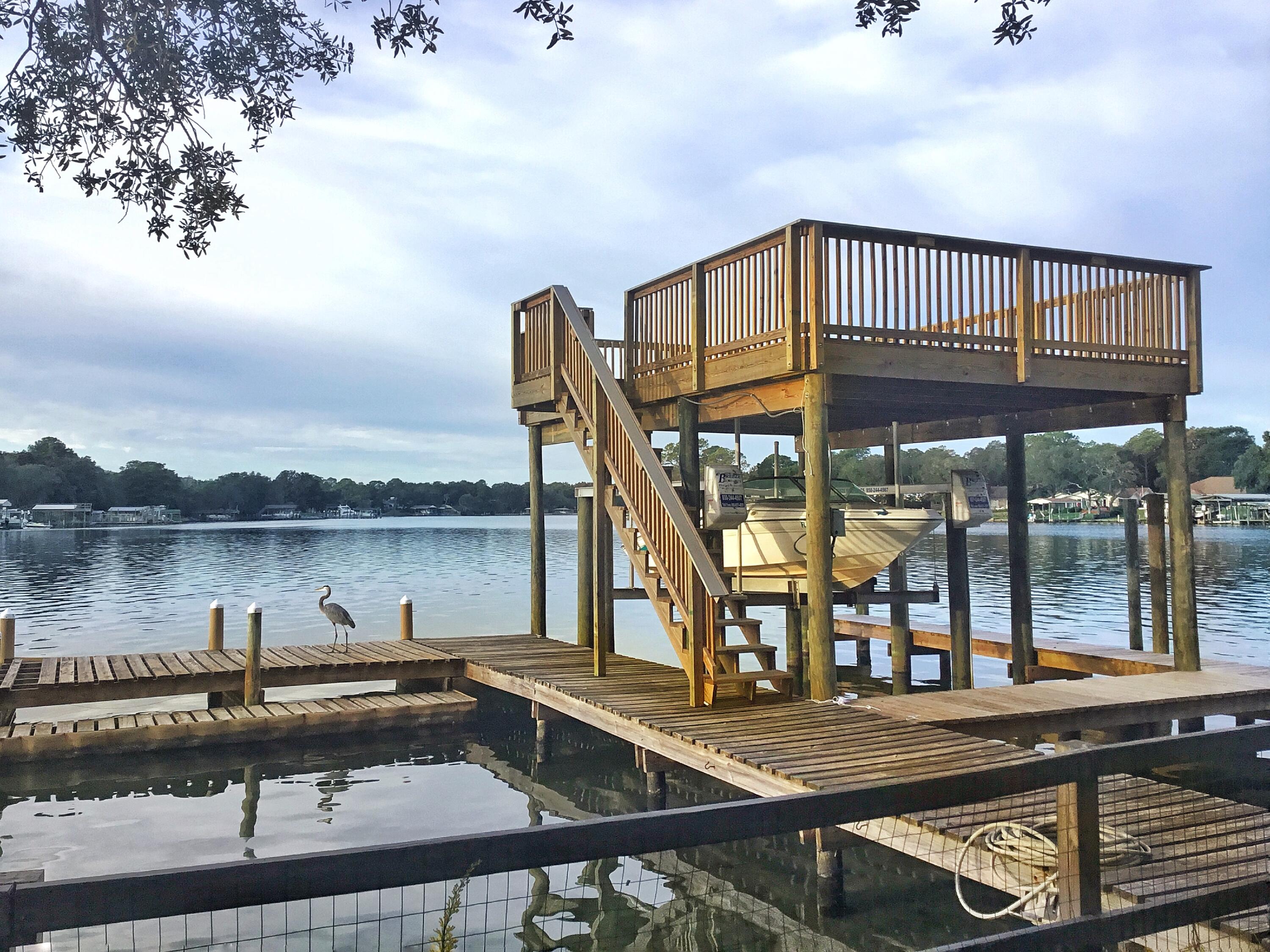 a view of a house with pool and deck