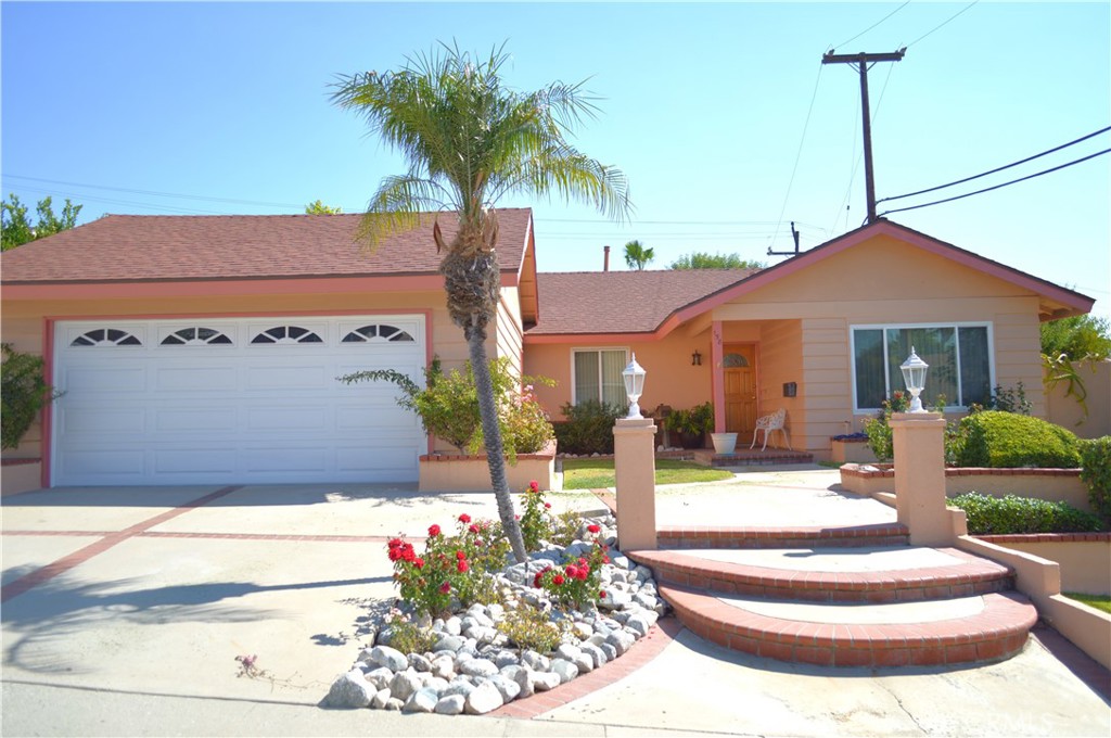 a front view of a house with a fountain and a fountain