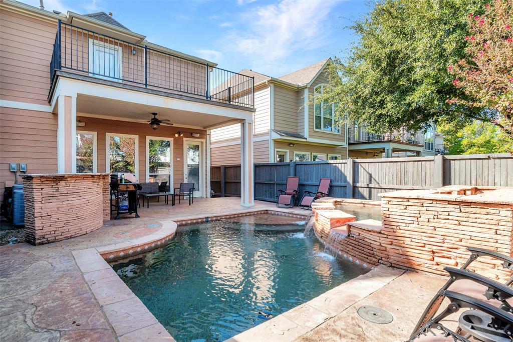 swimming pool view with a seating space