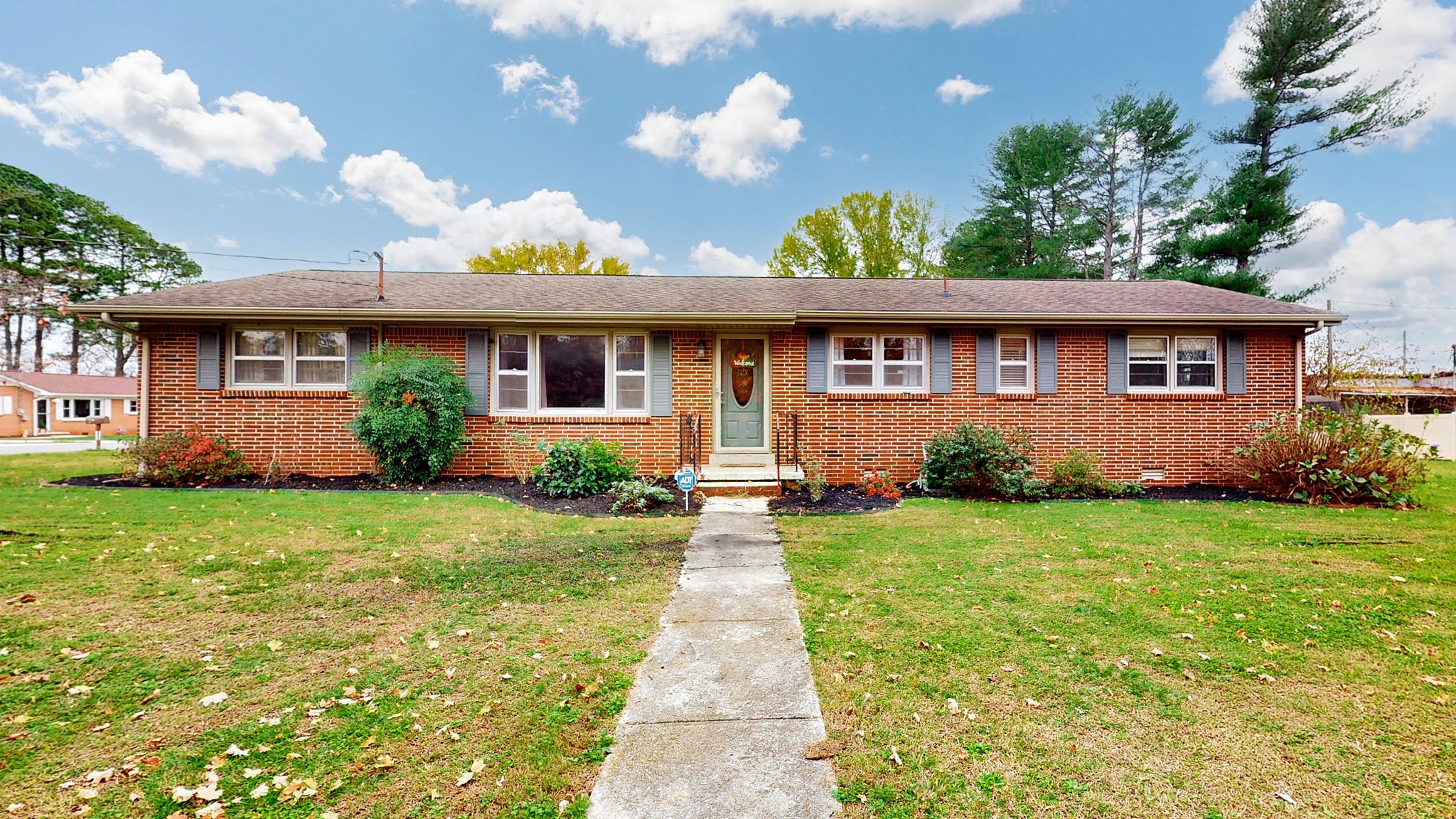 front view of a house with a yard