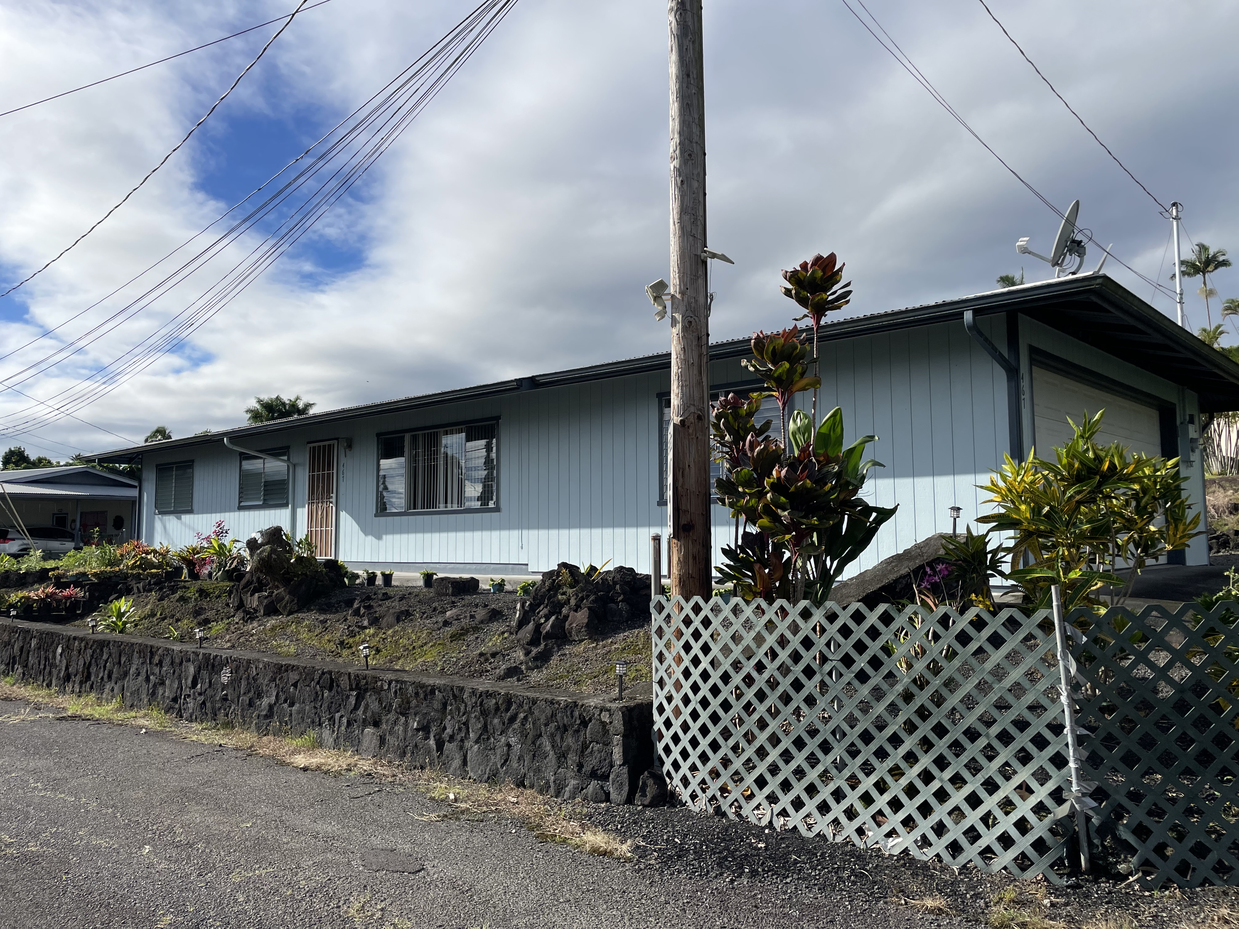 a front view of a house with garden