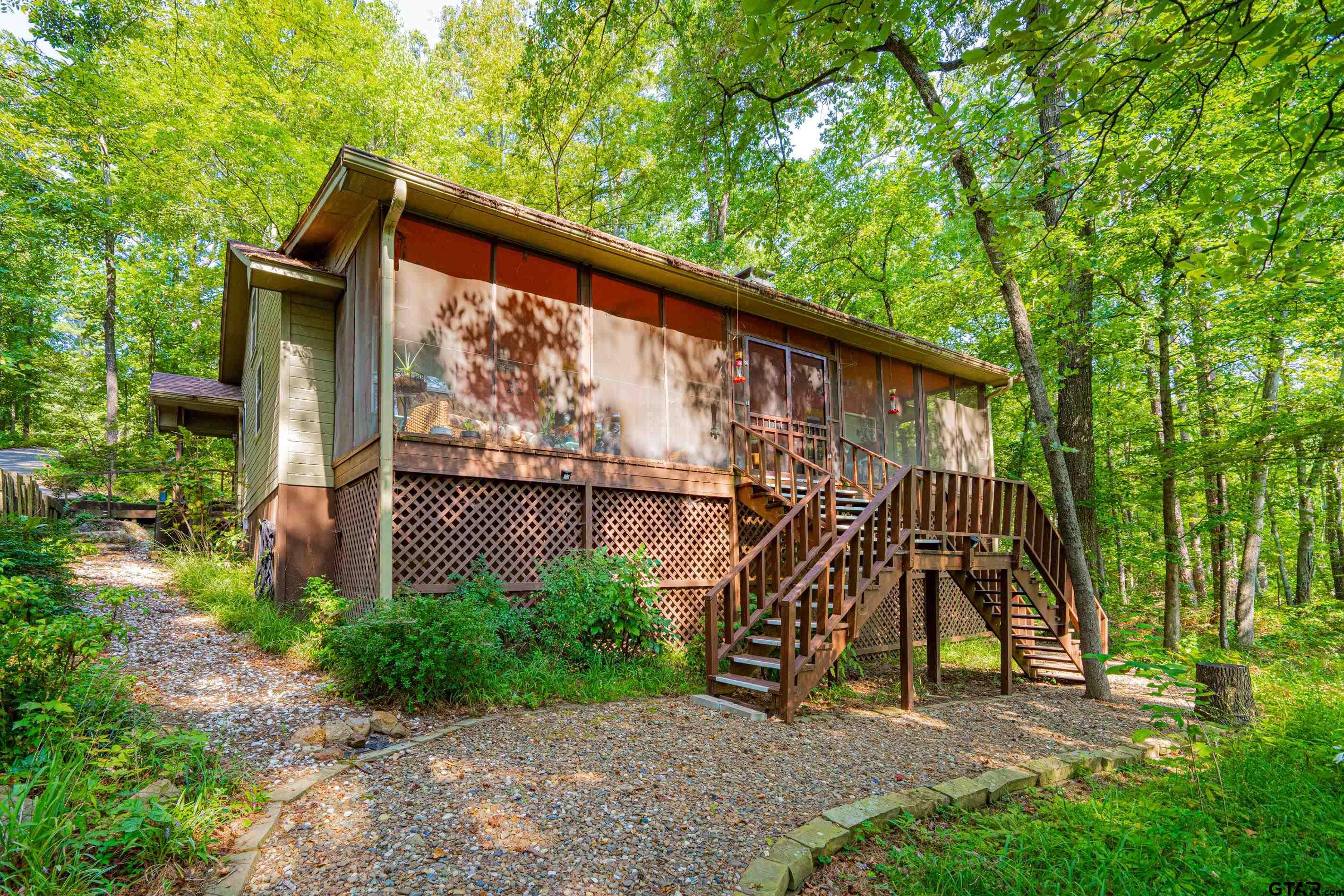 a view of backyard with a deck