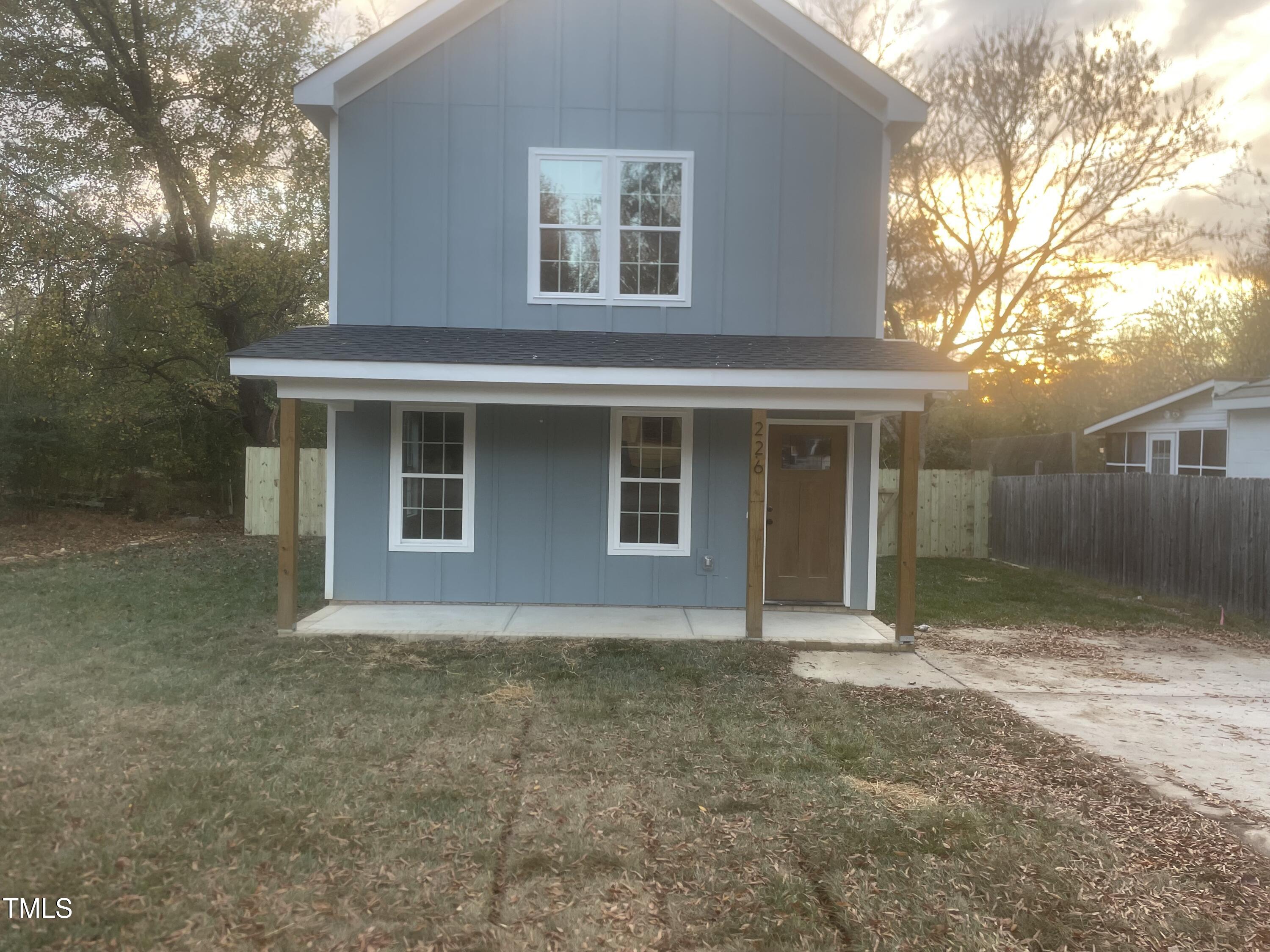 a house with trees in front of it