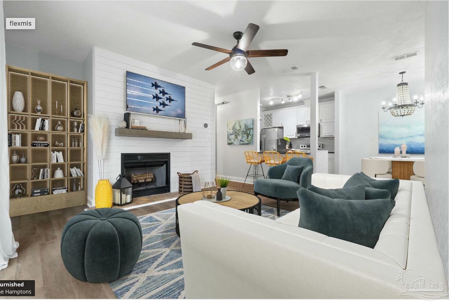 a living room with furniture and a fireplace