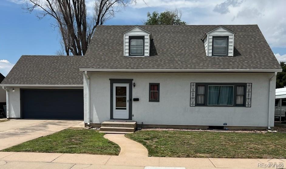 a house that has a tree in front of it