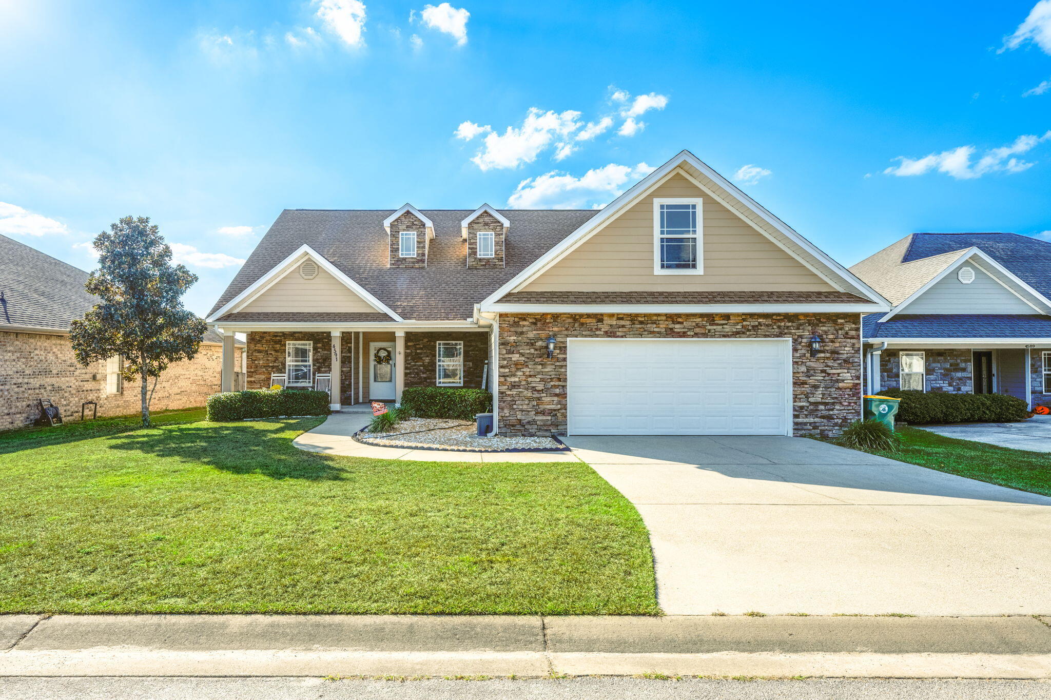 a front view of a house with a yard