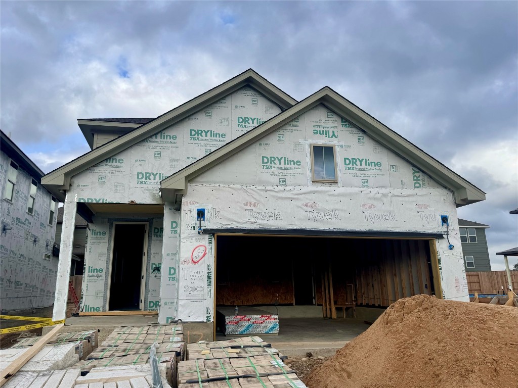 a front view of a house with yard