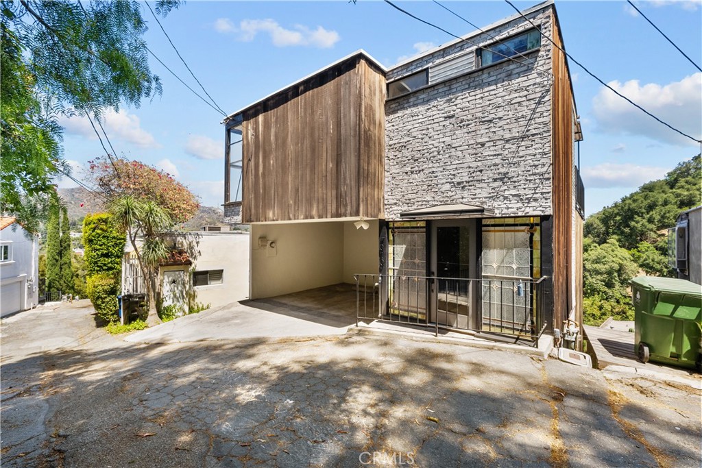 a view of a house with a garage and yard