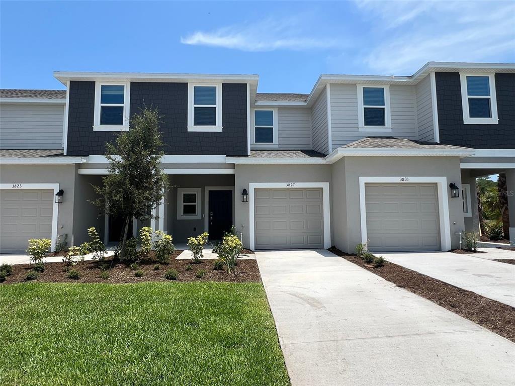 a front view of a house with a yard