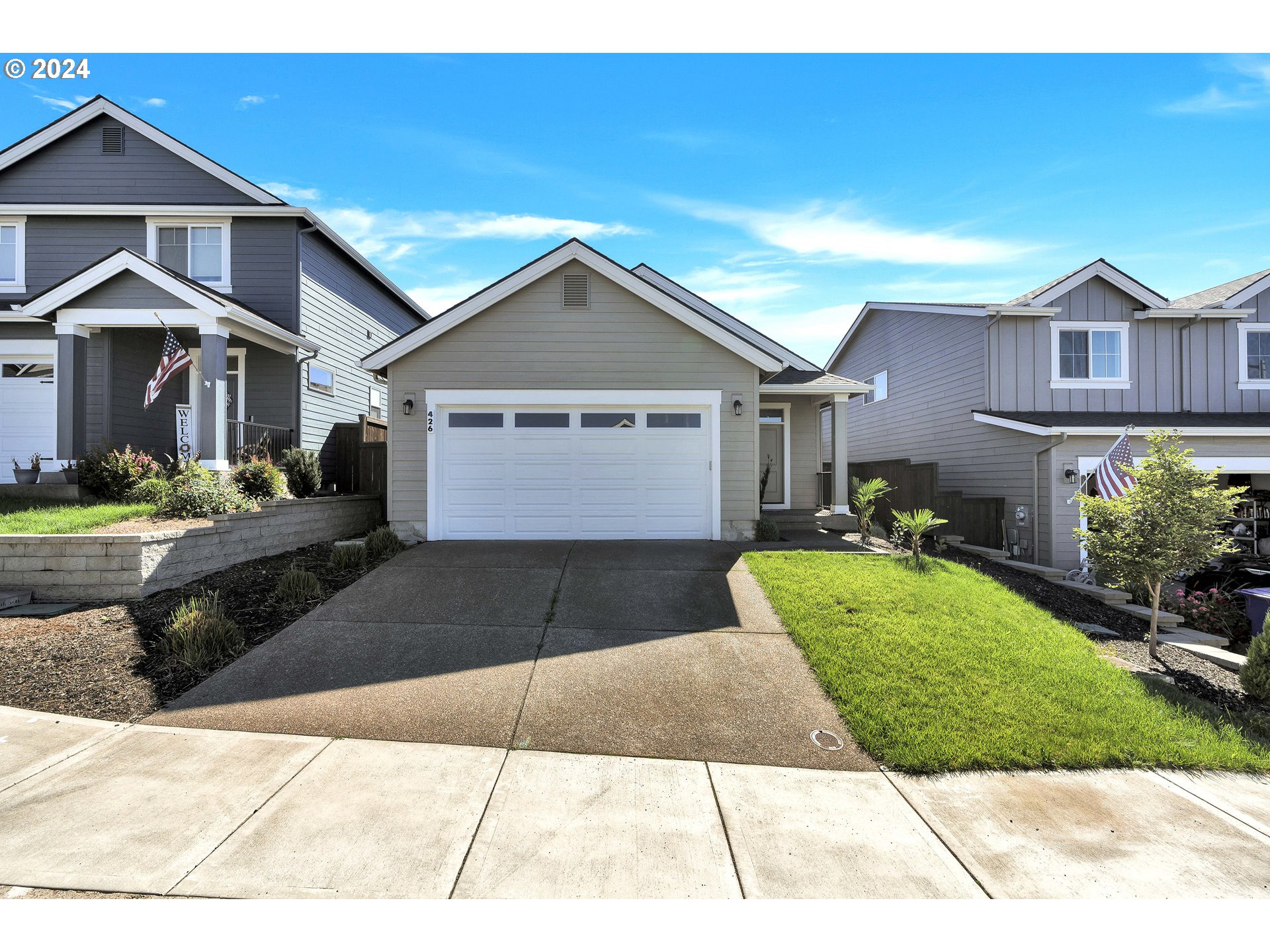 a front view of a house with a yard