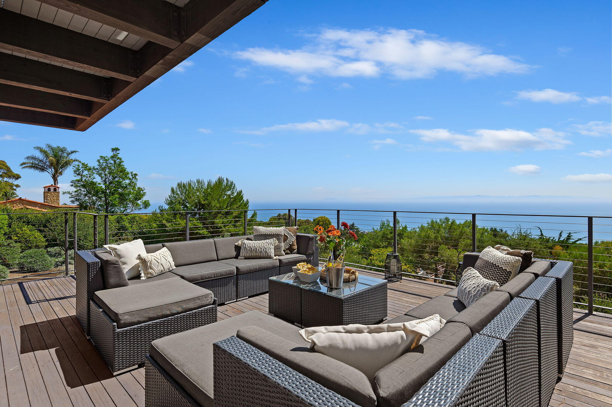 a view of a terrace with couches and potted plants