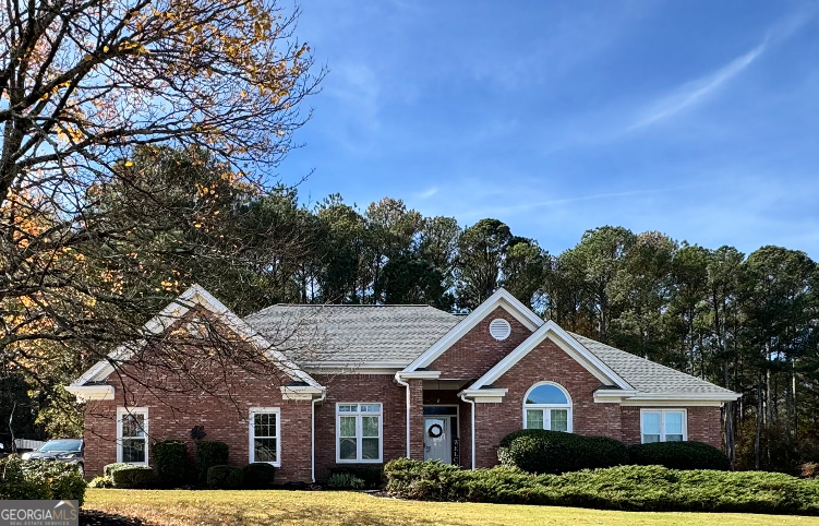 a front view of a house with a yard