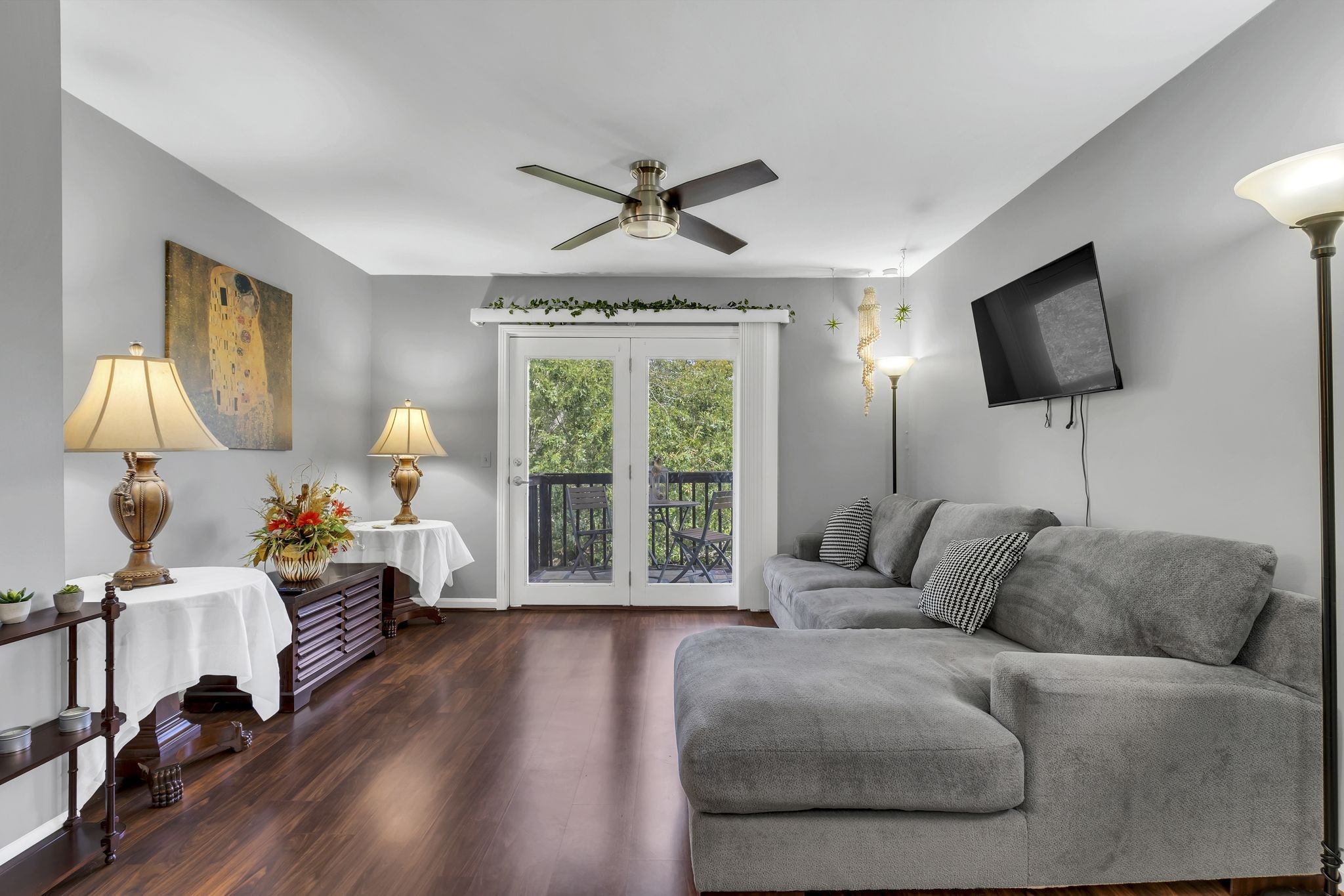 a living room with furniture fireplace and a large window