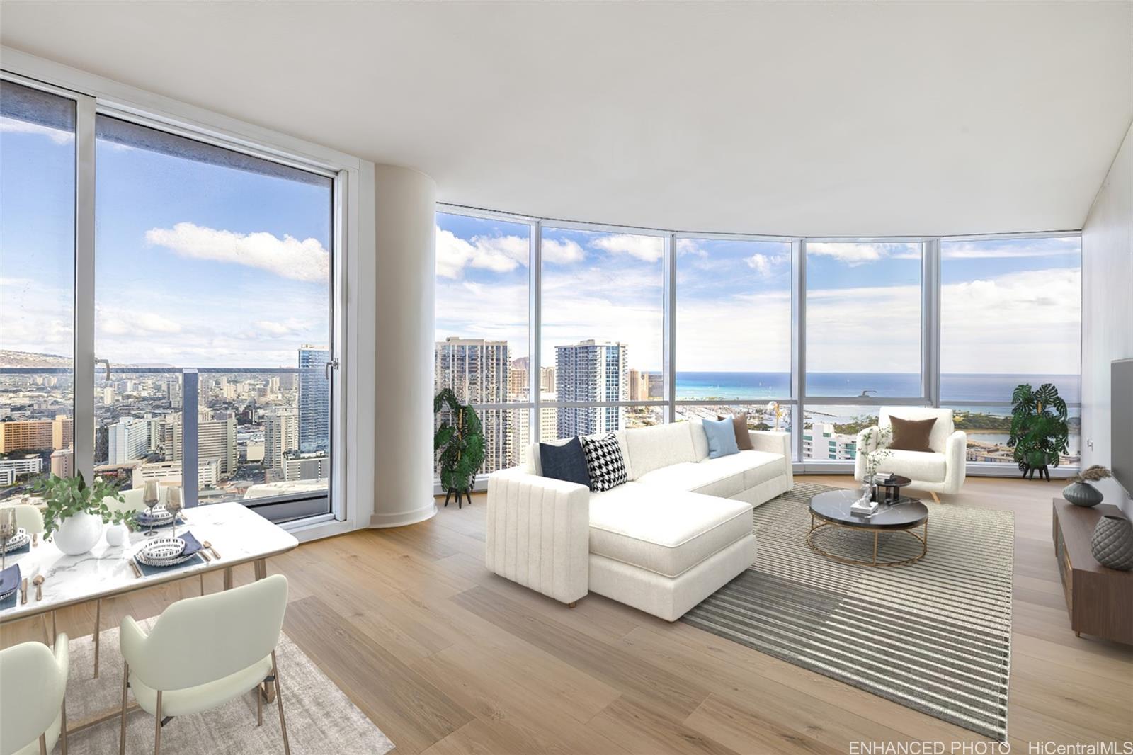 Expansive floor to ceiling windows featuring the City and Ocean views!  (Enhanced photo).