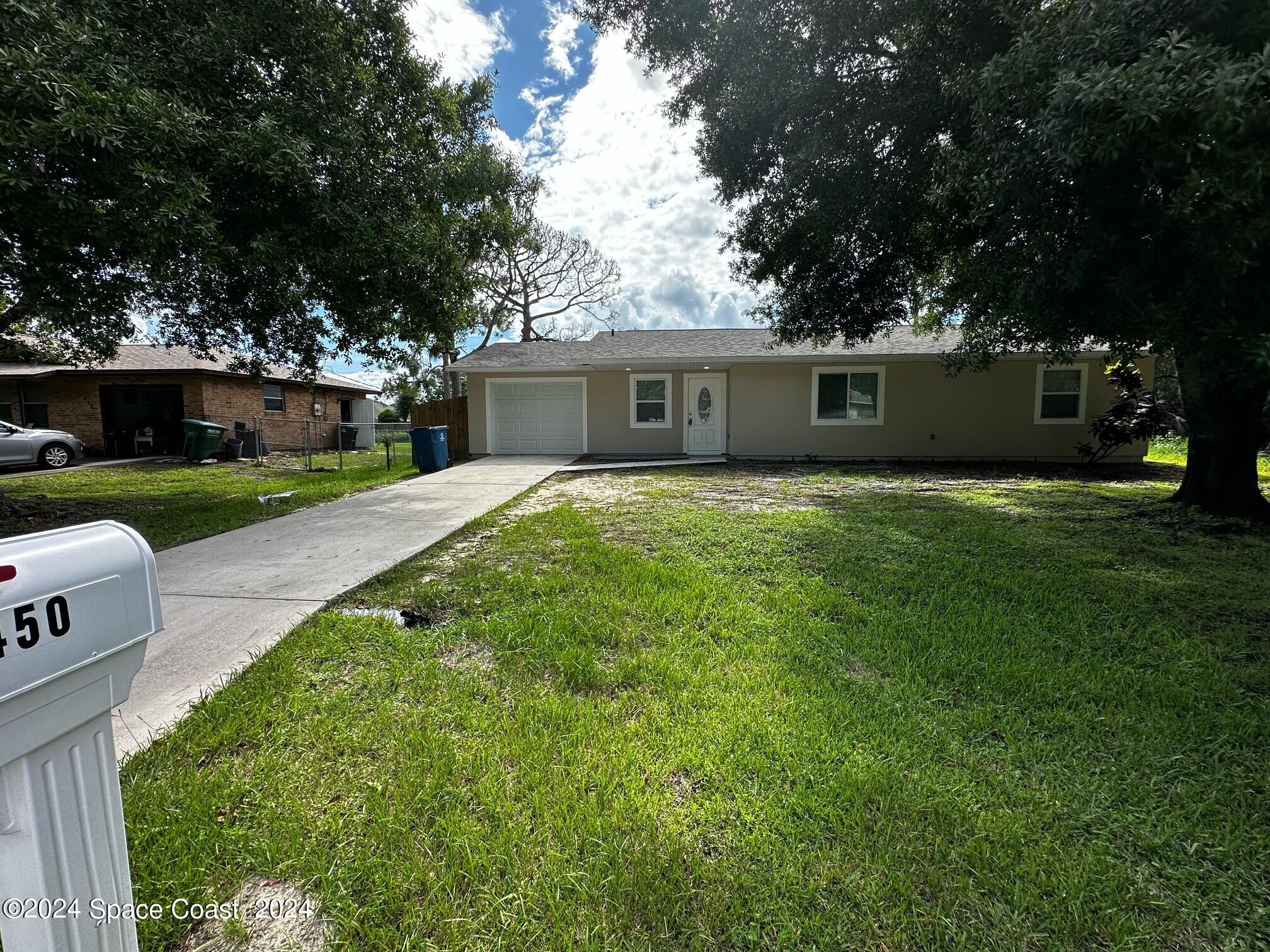 a front view of a house with yard