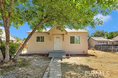 a house with trees in the background