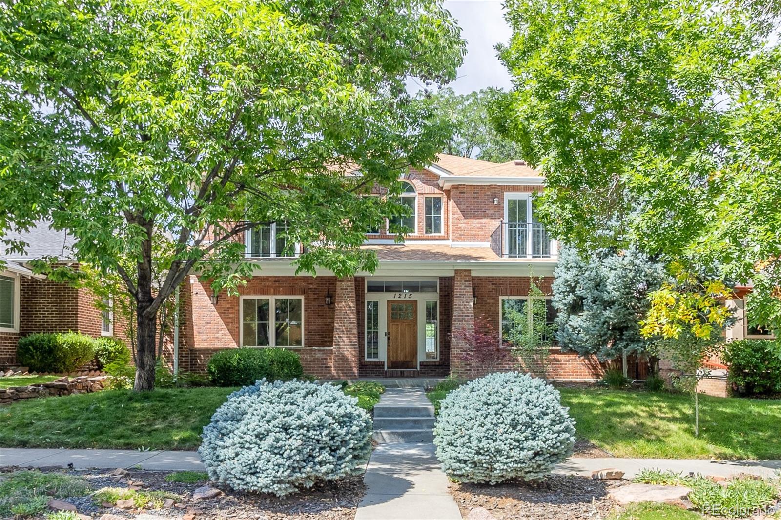 front view of a house with a garden