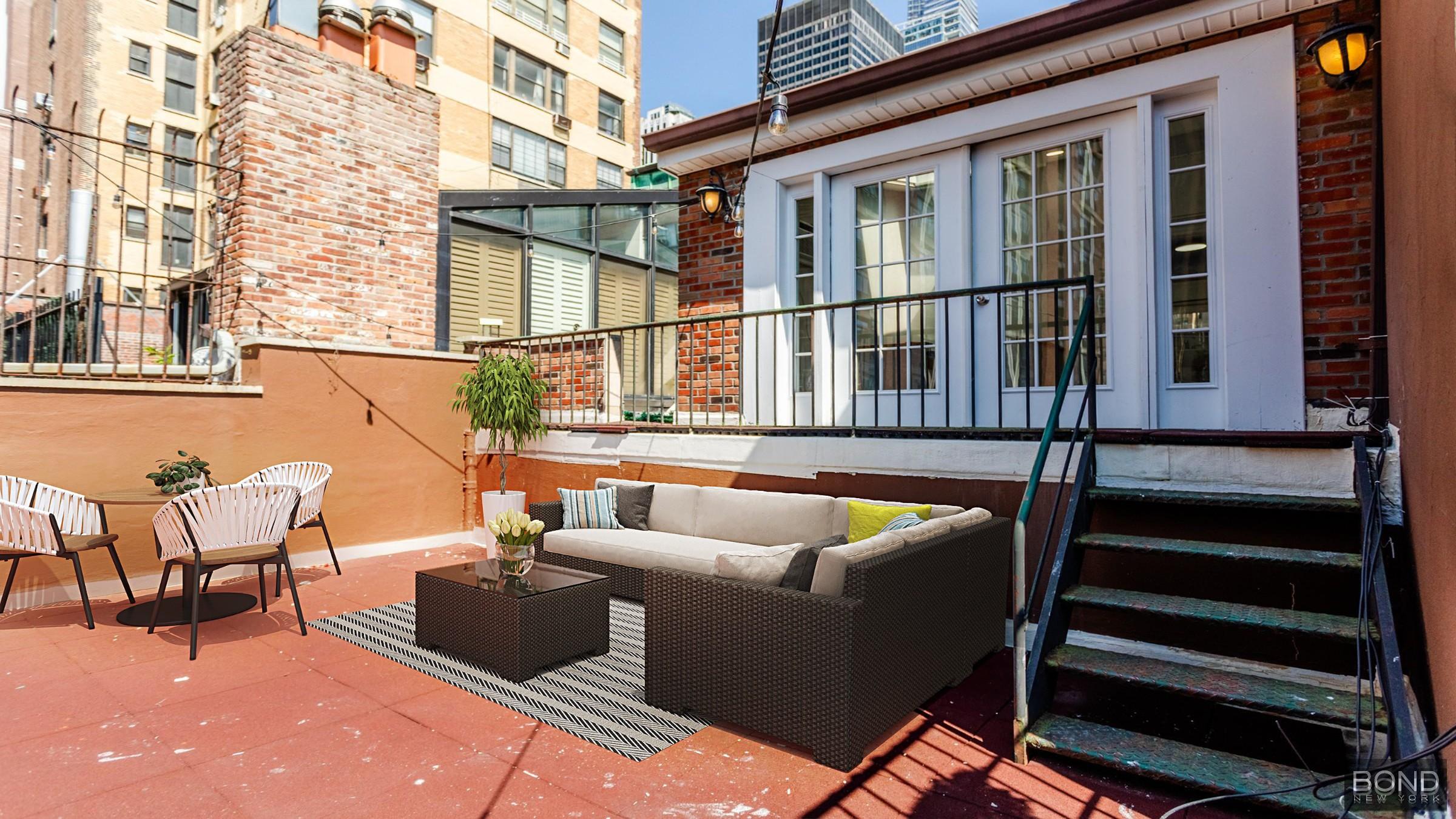 a balcony with furniture and a potted plant