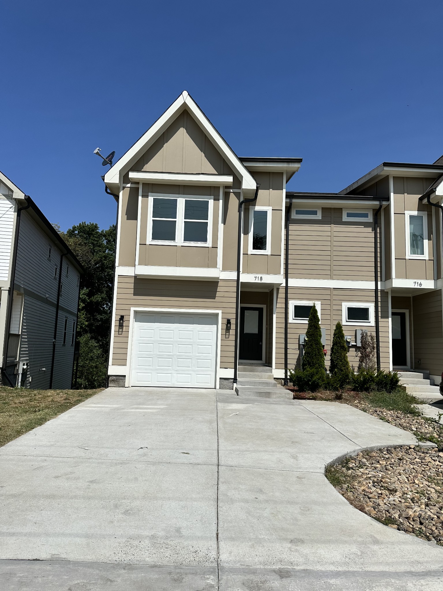 a front view of a house with garage