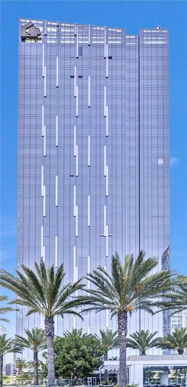 a view of a tall building with a garden