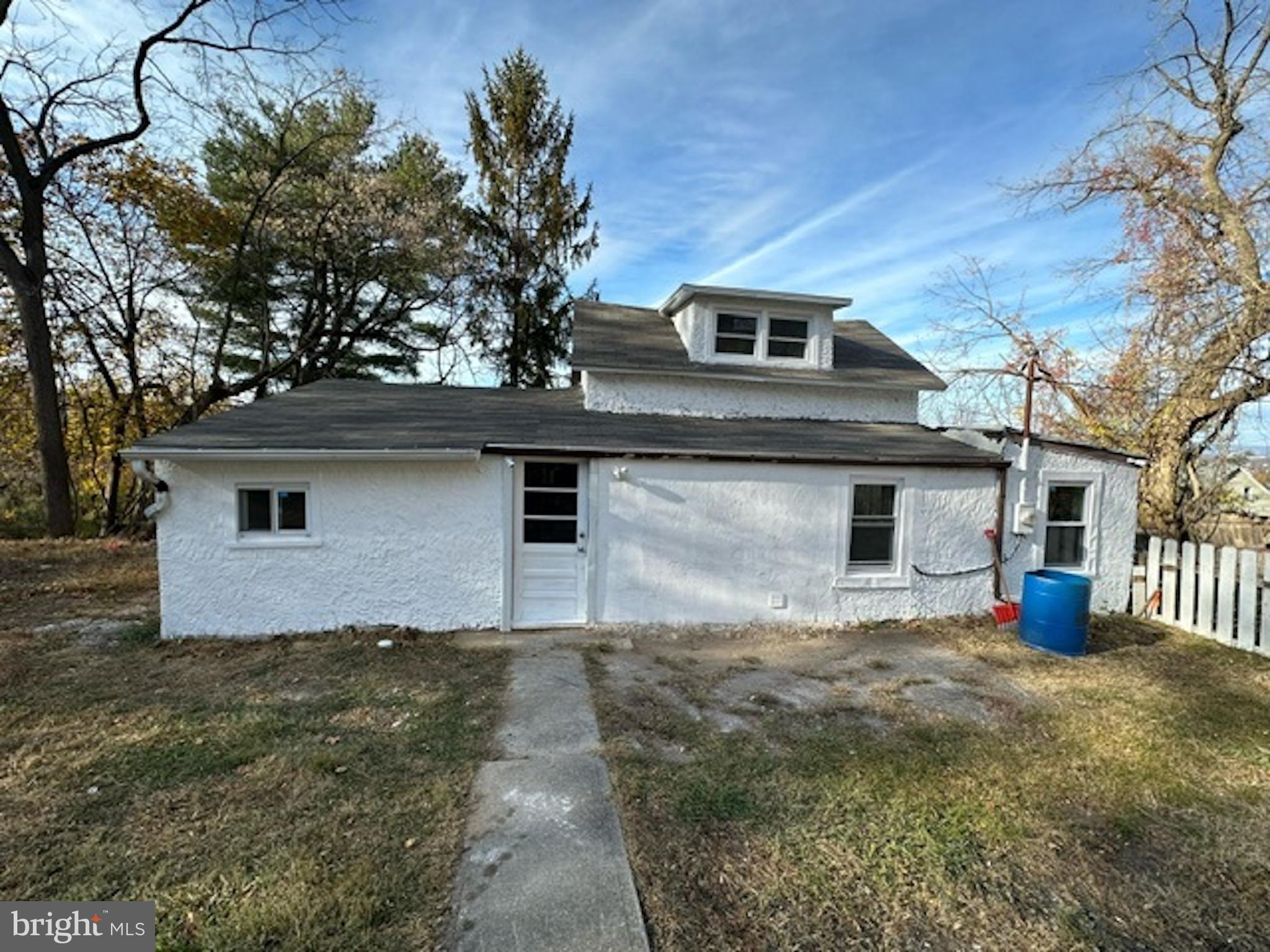 a front view of a house with yard