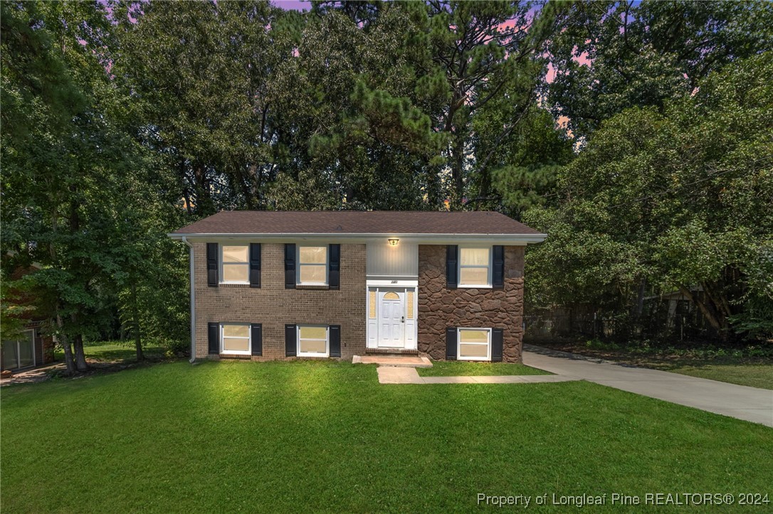 a front view of a house with a yard