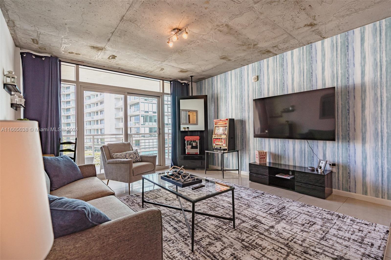 a living room with furniture and a flat screen tv