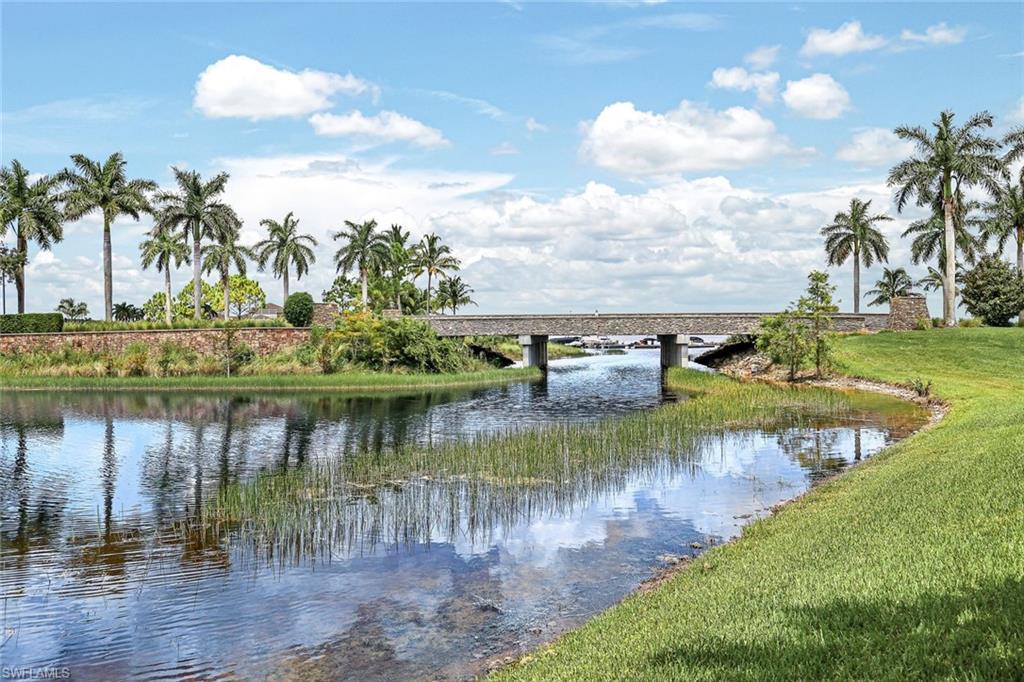 a view of a lake with a yard