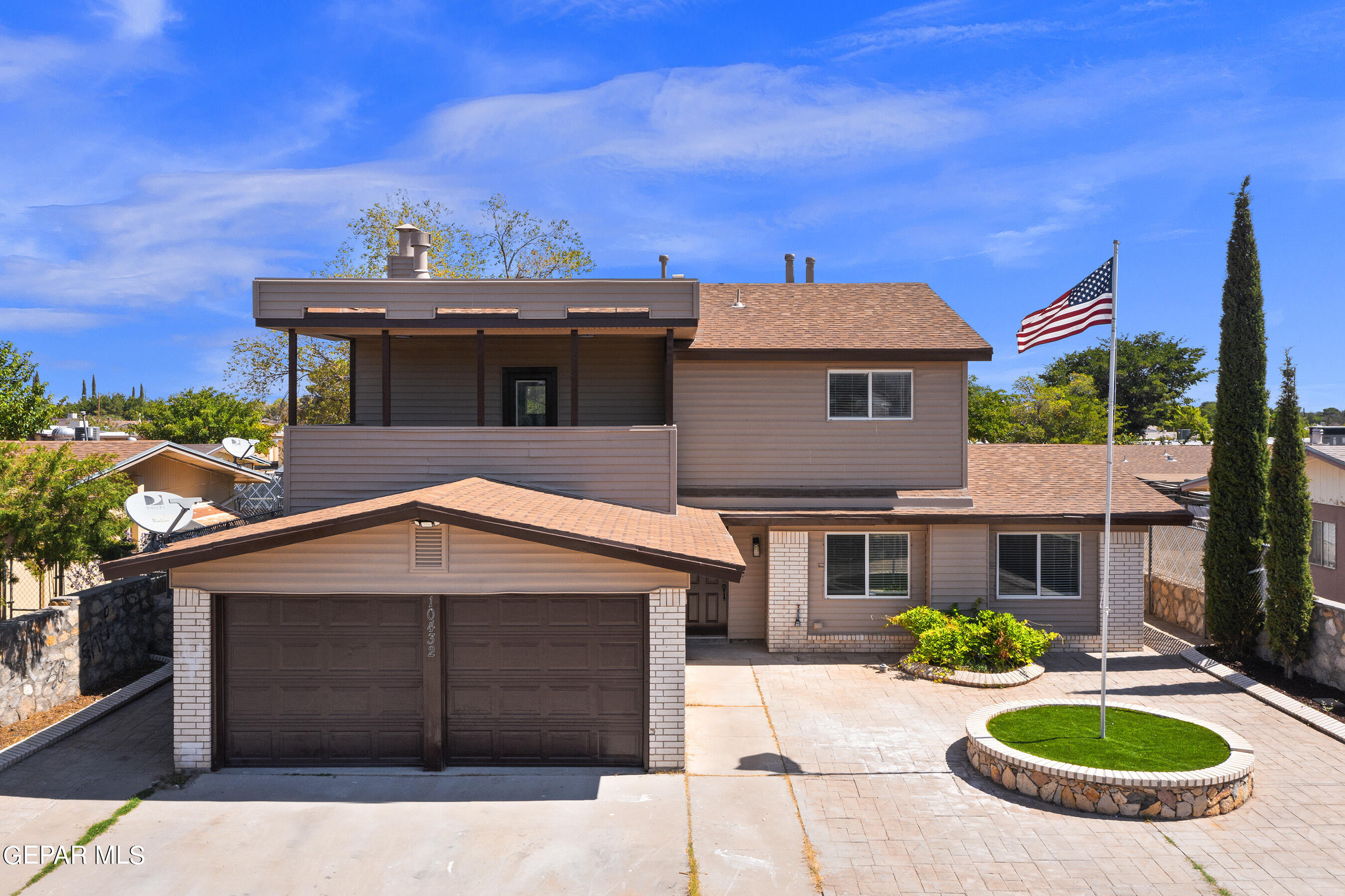 a front view of a house with yard