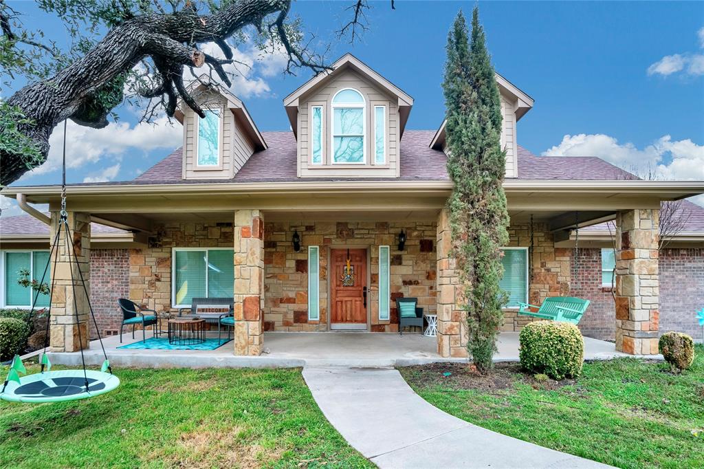 front view of a house with a yard