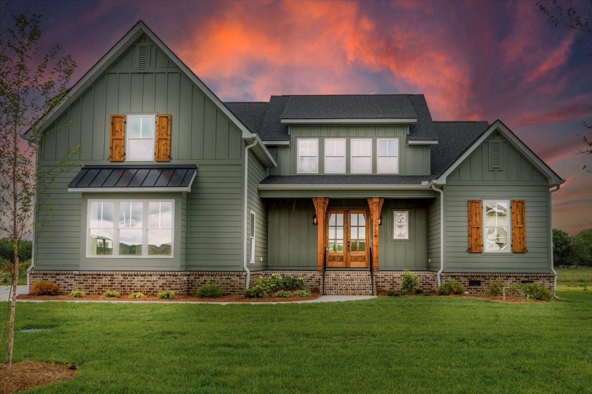 a front view of a house with a yard