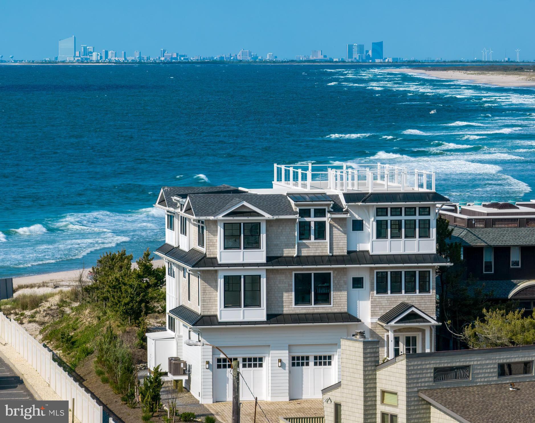 a front view of a house with a ocean view